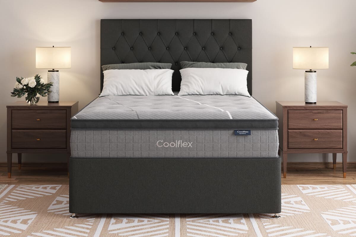 Image of the grey Coolflex cooling mattress on a black divan bed.