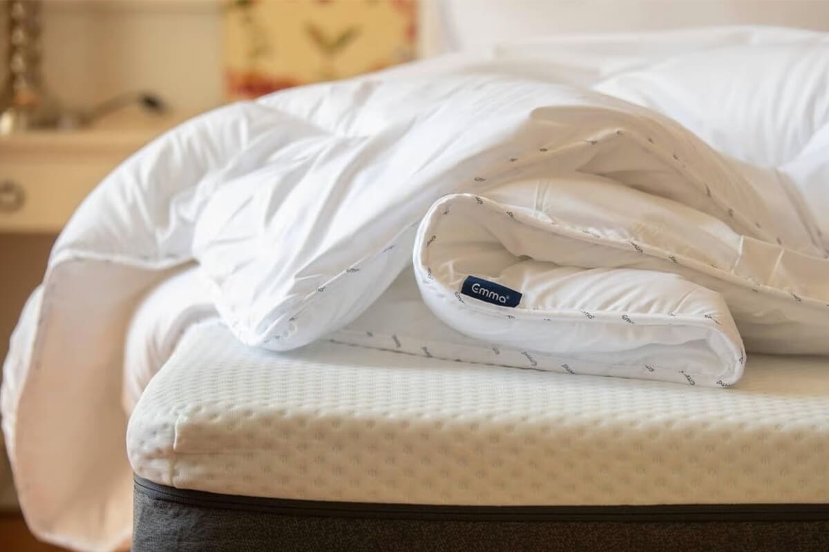 Image of the Emma Cloud Duvet folded on a bed.