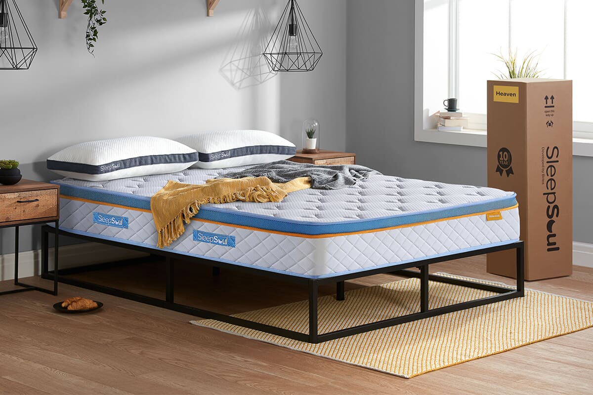 Image of the SleepSoul Heaven 2000 CoolGel Pillow Top Mattress on a simple black bed frame.