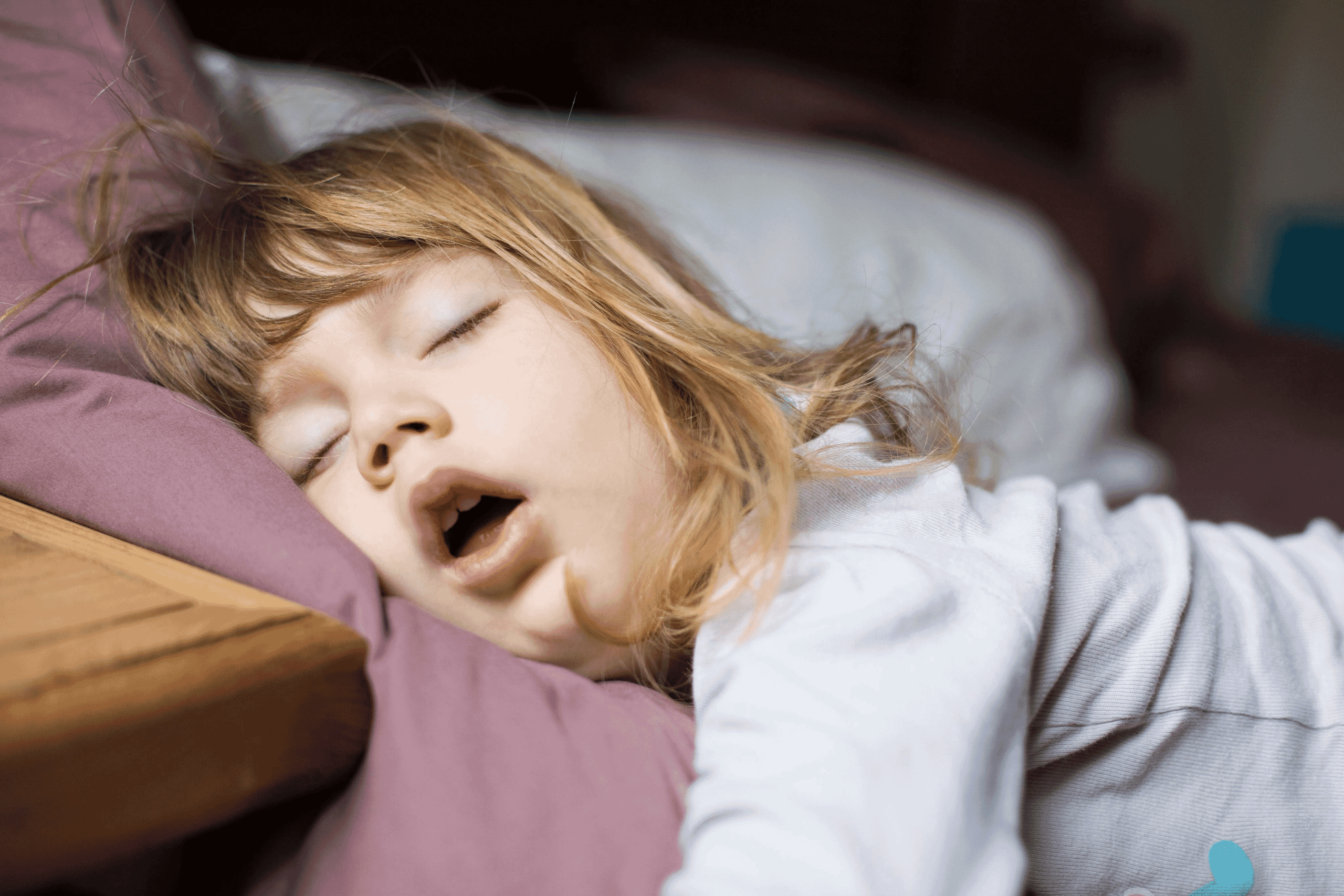Young girl sleeping with her mouth open.