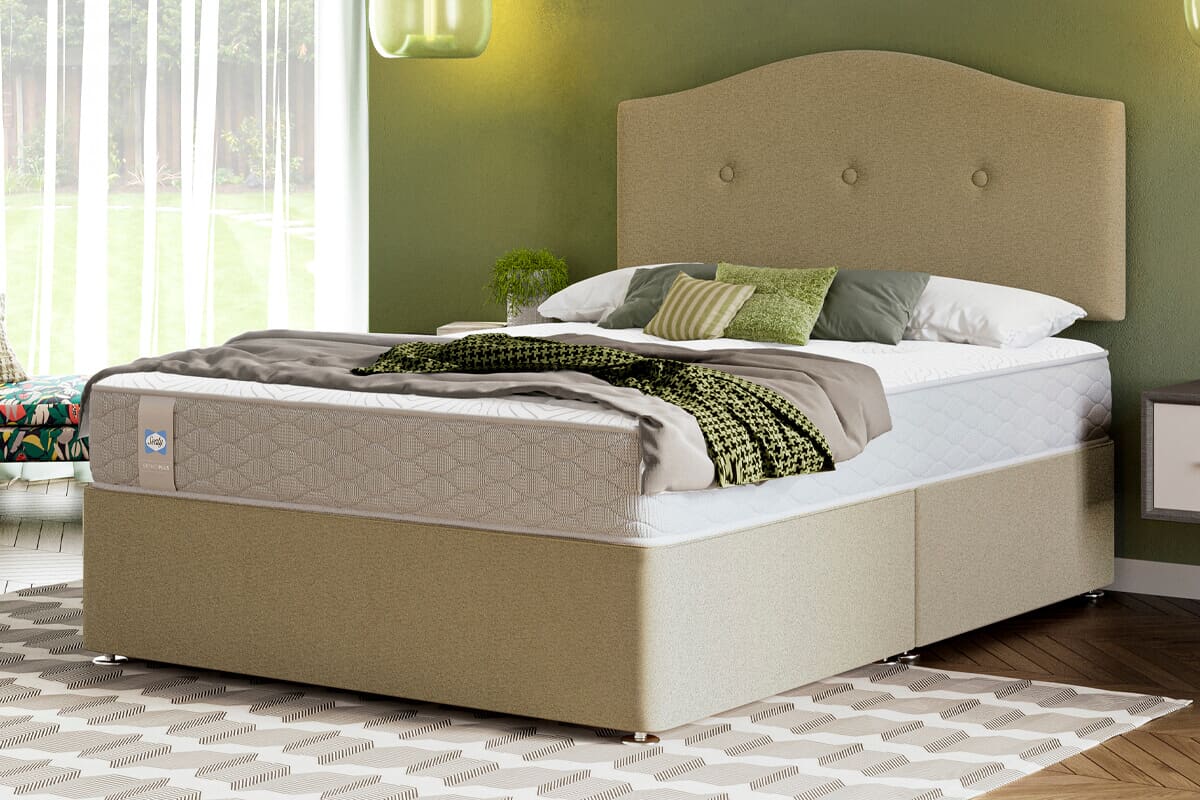 lifestyle image with cream and green theme of a divan bed and mattress.