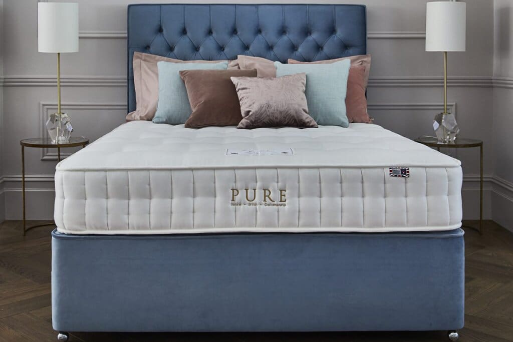 A Sleepeezee Pure Imperial 2000 Pocket Natural Mattress on top of a divan bed