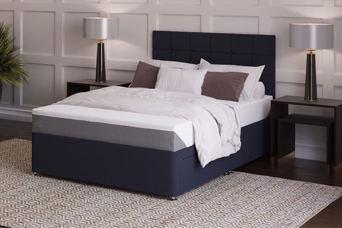 Image of the tempur firm mattress on a dark divan bed in a modern, stylish bedroom.