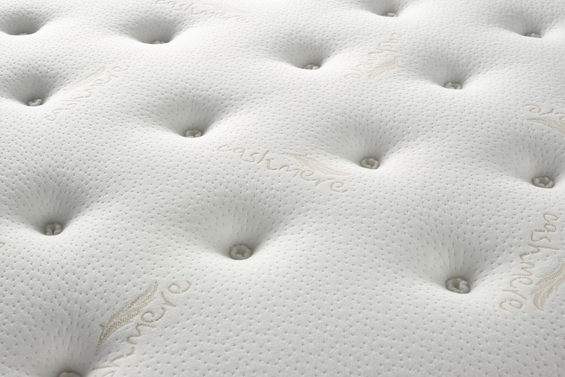 Close up of the soft tufted surface of the Dreamland Cashmere Mattress.