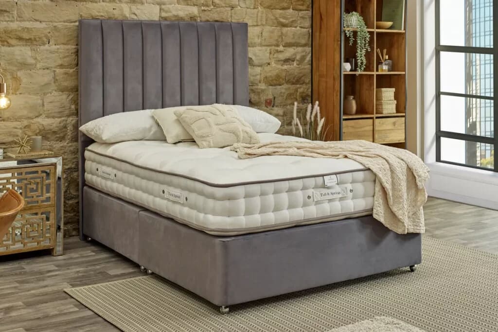 Image of the luxury mattress tuft and springs enchantment on a grey divan base.