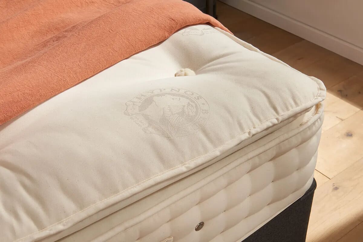 Close up of the corner of a Hypnos pillow top mattress.