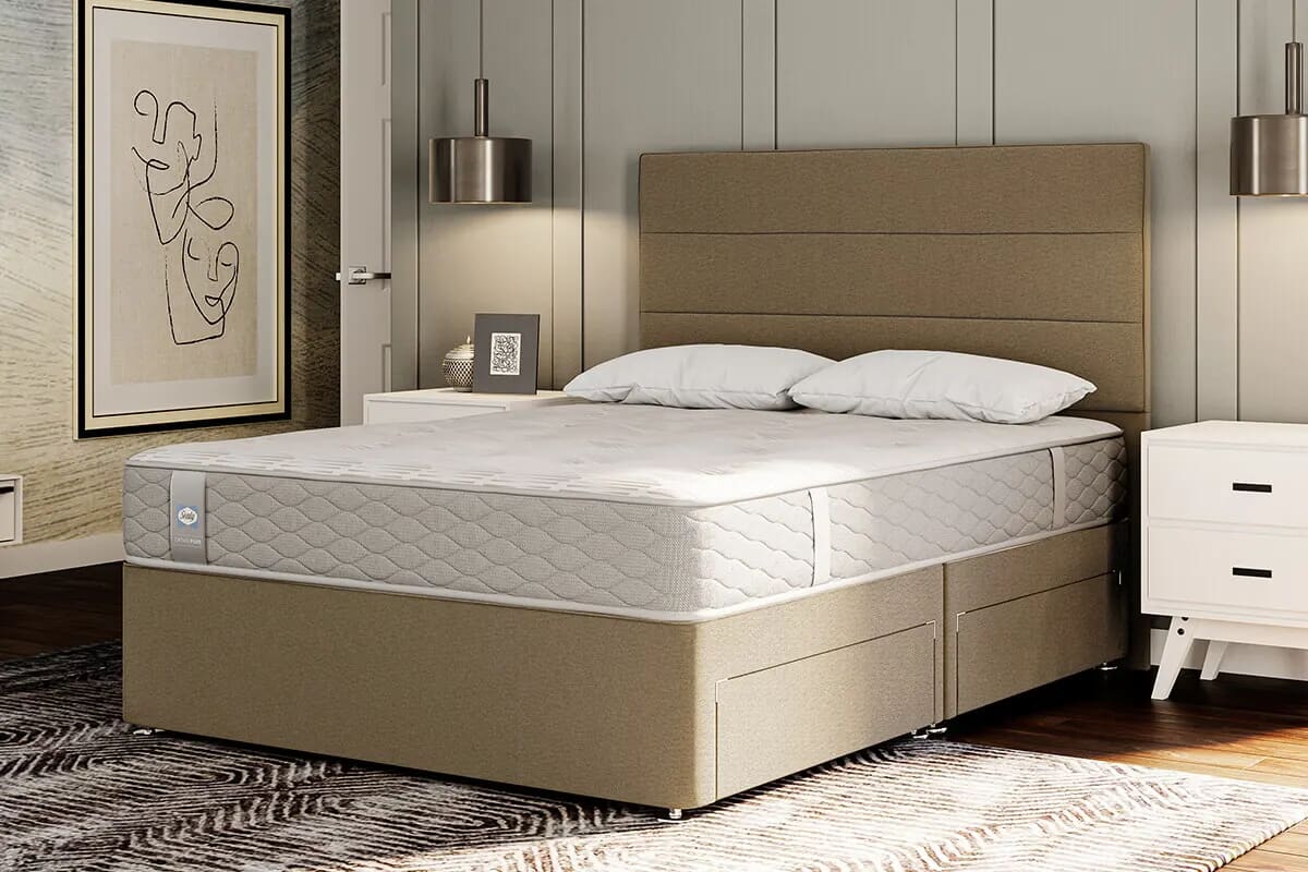 Image of the best mattress for sex on a beige divan bed with stroage.
