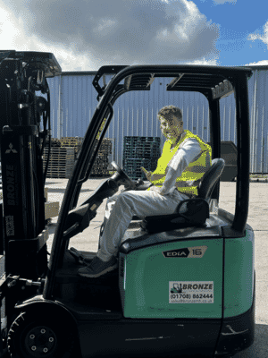 Fifth trust student sat in forklift.