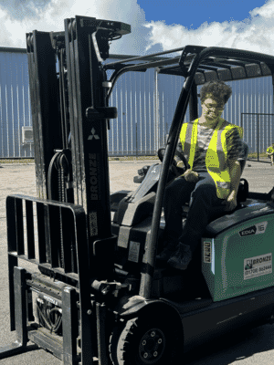 Fifth trust student sat in forklift.