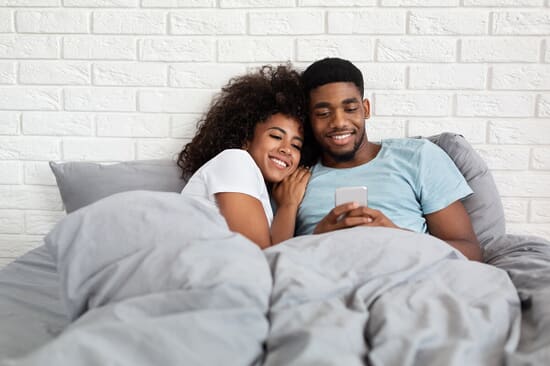 Two people on bed