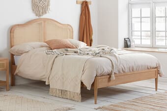 A product image for the Leonie Rattan Oak Bed