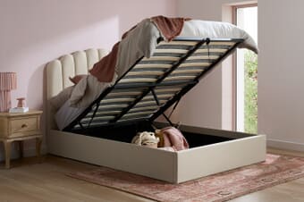 A product image for the Monaco Beige Fabric Ottoman Bed