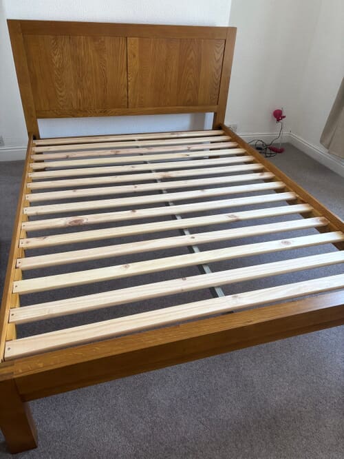 A customer photo for Bellevue Solid Oak Bed - Good quality simple wooden frame which easy to assemble. The slats have to be ad. Author: Julie. Dated: 2026-07-19